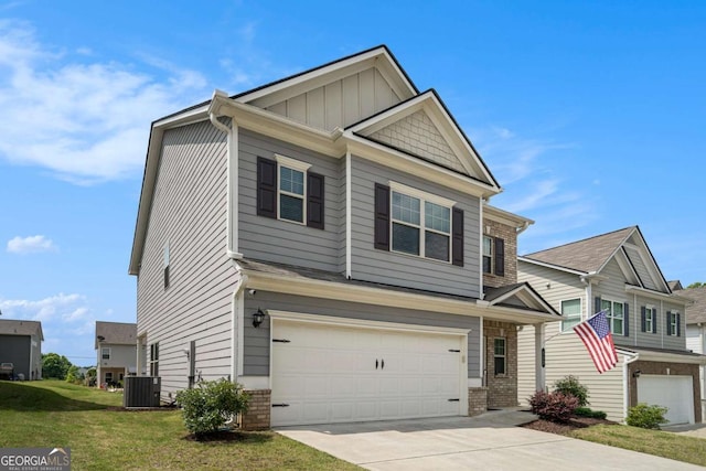 113 Waterside Dr, Calhoun, GA 30701 - craftsman inspired home featuring an attached garage, cooling unit, concrete driveway, a front yard, and brick siding