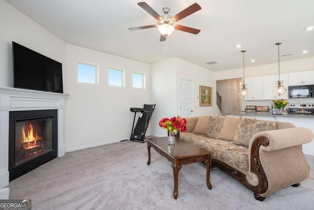 113 Waterside Dr, Calhoun, GA 30701 - living room featuring light carpet, ceiling fan, a glass covered fireplace, recessed lighting, and baseboards