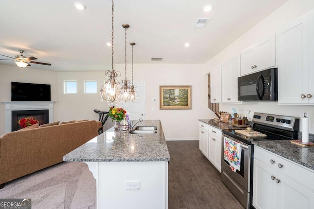 113 Waterside Dr, Calhoun, GA 30701 - kitchen with black microwave, stainless steel electric range oven, a sink, open floor plan, and recessed lighting