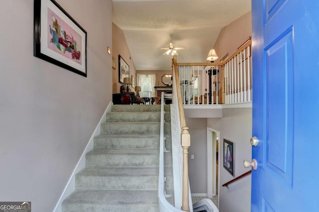 1818 Mcconnell Rd, Grayson, GA 30017 - stairway featuring baseboards and ceiling fan