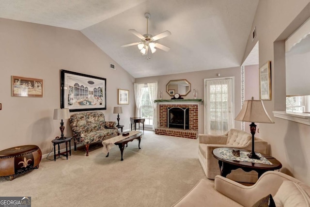 1818 Mcconnell Rd, Grayson, GA 30017 - carpeted living area featuring vaulted ceiling, ceiling fan, plenty of natural light, and a fireplace
