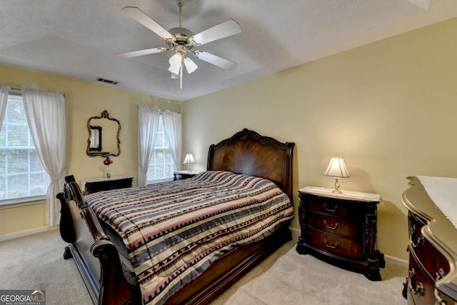 1818 Mcconnell Rd, Grayson, GA 30017 - bedroom featuring light colored carpet, multiple windows, baseboards, and ceiling fan