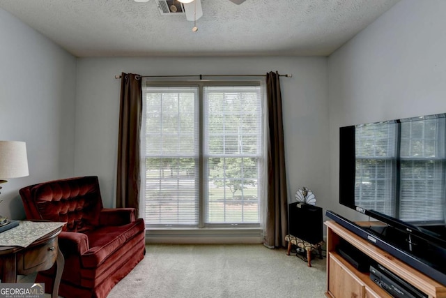 1818 Mcconnell Rd, Grayson, GA 30017 - sitting room with light colored carpet, healthy amount of natural light, a textured ceiling, and a ceiling fan
