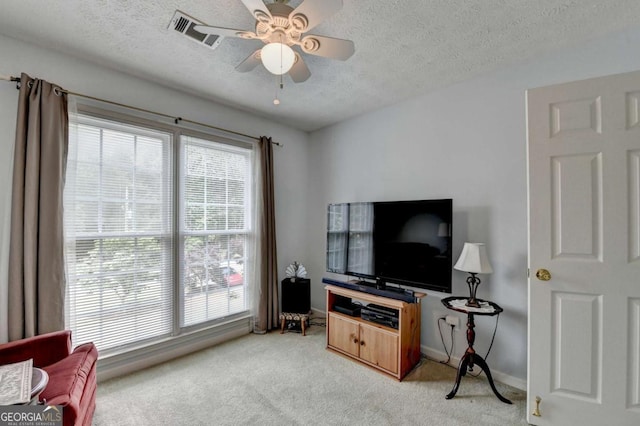1818 Mcconnell Rd, Grayson, GA 30017 - living room with light colored carpet, a textured ceiling, ceiling fan, and baseboards