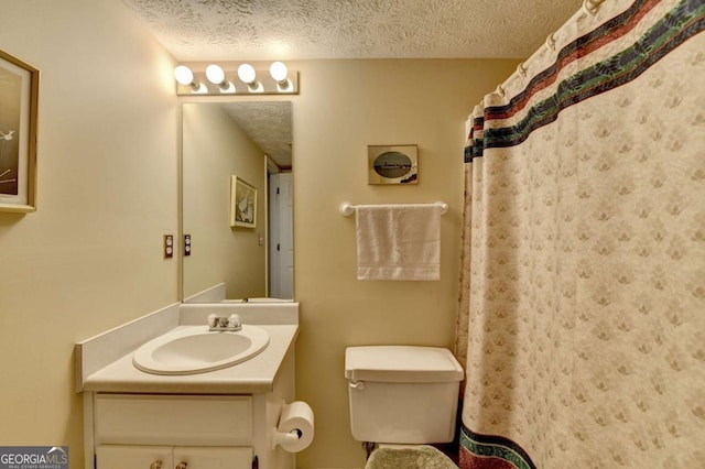 1818 Mcconnell Rd, Grayson, GA 30017 - bathroom featuring vanity, a textured ceiling, and toilet