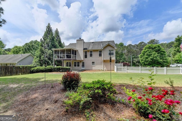 1818 Mcconnell Rd, Grayson, GA 30017 - back of property featuring a sunroom and a chimney
