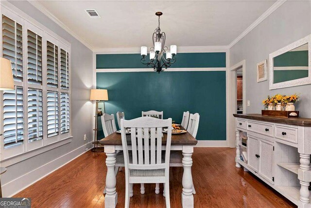 1132 Ivey Brook Dr, Bethlehem, GA 30620 - dining area with a chandelier, wood finished floors, and ornamental molding