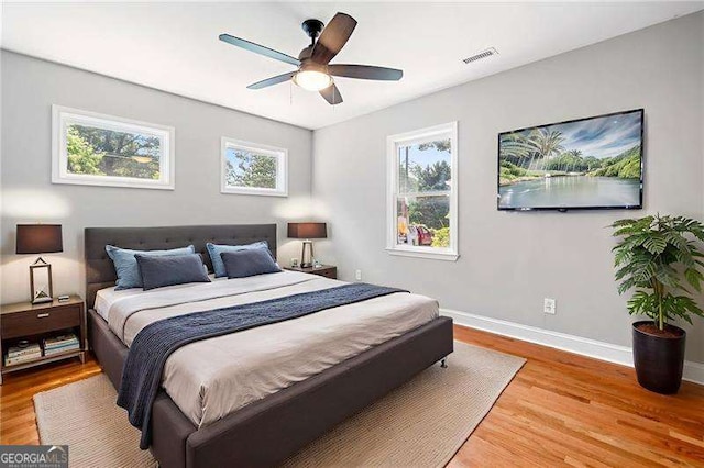 3274 Ridgecrest Rd SE, Smyrna, GA 30080 - bedroom with light wood-style floors, baseboards, and a ceiling fan
