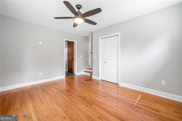 3274 Ridgecrest Rd SE, Smyrna, GA 30080 - unfurnished bedroom featuring baseboards, light wood-style flooring, a closet, and a ceiling fan