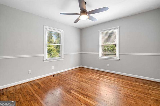 3274 Ridgecrest Rd SE, Smyrna, GA 30080 - spare room with hardwood / wood-style floors, baseboards, and ceiling fan