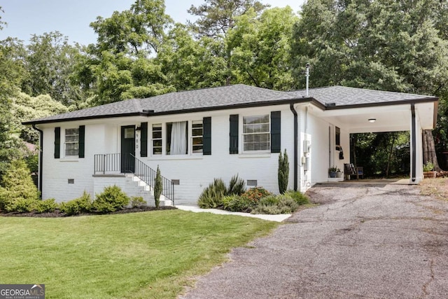 980 Oglethorpe Ave, Athens, GA 30606 - view of front of property featuring driveway, a front lawn, brick siding, an attached carport, and roof with shingles
