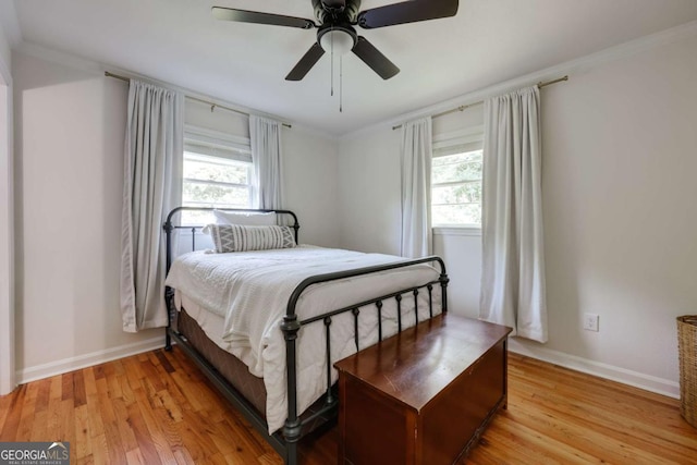 980 Oglethorpe Ave, Athens, GA 30606 - bedroom featuring light wood-style flooring, a ceiling fan, and crown molding