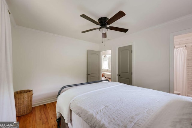 980 Oglethorpe Ave, Athens, GA 30606 - bedroom with wood finished floors, crown molding, and a ceiling fan