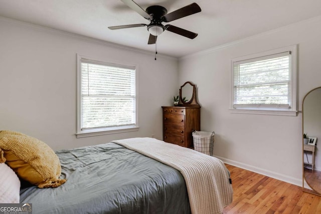 980 Oglethorpe Ave, Athens, GA 30606 - bedroom with light wood finished floors, crown molding, and a ceiling fan