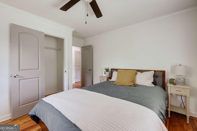 980 Oglethorpe Ave, Athens, GA 30606 - bedroom with ornamental molding, wood finished floors, a closet, and ceiling fan