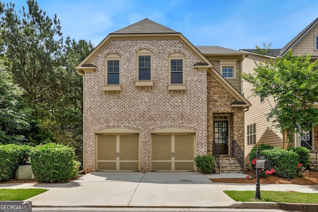 189 Privet Cir, Suwanee, GA 30024 - view of front of home featuring an attached garage, driveway, and brick siding