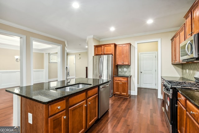 189 Privet Cir, Suwanee, GA 30024 - kitchen with appliances with stainless steel finishes, dark wood-style flooring, dark stone counters, decorative backsplash, and crown molding
