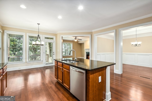 189 Privet Cir, Suwanee, GA 30024 - kitchen with dishwasher, a sink, a chandelier, a warm lit fireplace, and crown molding