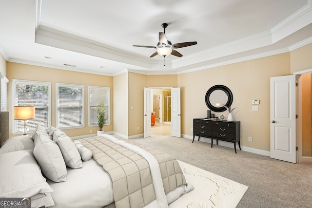 189 Privet Cir, Suwanee, GA 30024 - bedroom featuring a tray ceiling, crown molding, light carpet, baseboards, and a ceiling fan