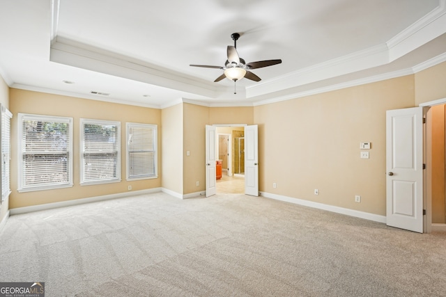 189 Privet Cir, Suwanee, GA 30024 - spare room with a raised ceiling, crown molding, light colored carpet, ceiling fan, and baseboards