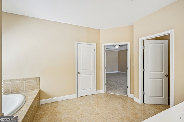 189 Privet Cir, Suwanee, GA 30024 - bathroom featuring a garden tub and tile patterned flooring
