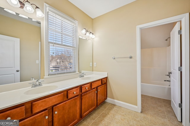 189 Privet Cir, Suwanee, GA 30024 - bathroom with double vanity, tile patterned floors, shower / bathtub combination, and baseboards