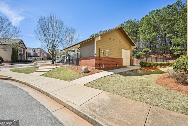 189 Privet Cir, Suwanee, GA 30024 - view of home's exterior with brick siding and a gate