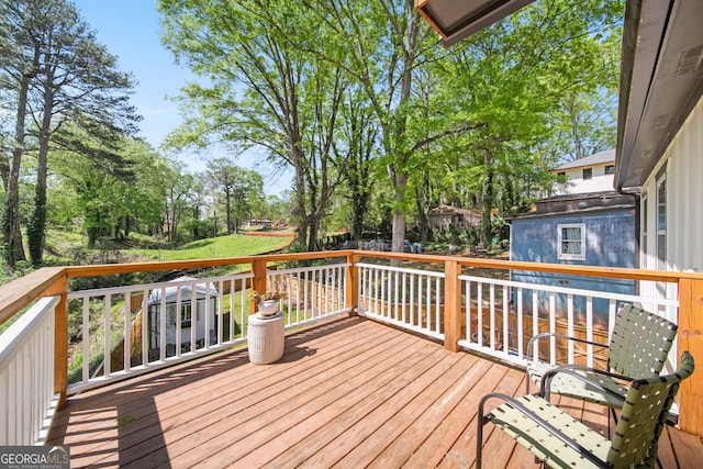 308 Reed St, Scottdale, GA 30079 - wooden terrace with view of scattered trees