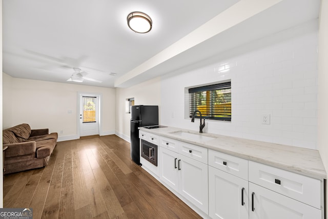 308 Reed St, Scottdale, GA 30079 - living area featuring dark wood-style flooring and a ceiling fan