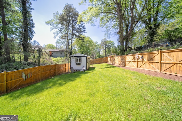 308 Reed St, Scottdale, GA 30079 - fenced backyard featuring a storage shed