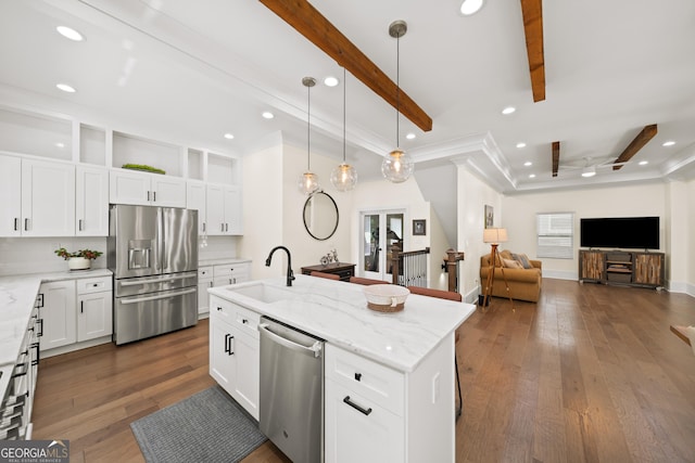 308 Reed St, Scottdale, GA 30079 - kitchen with stainless steel appliances, recessed lighting, ornamental molding, dark wood-type flooring, and light stone countertops