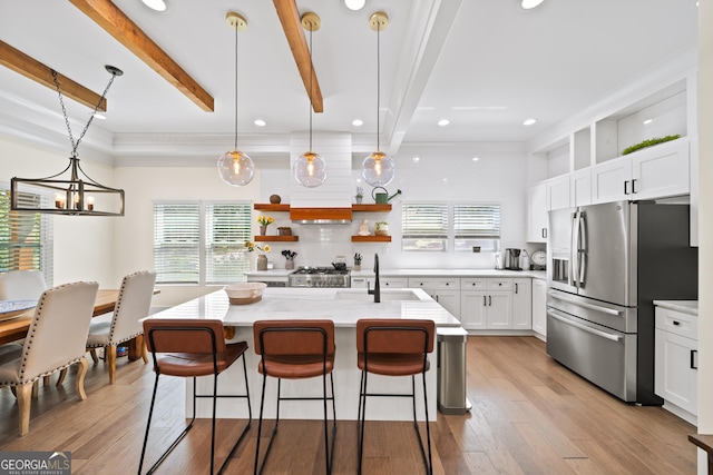 308 Reed St, Scottdale, GA 30079 - kitchen featuring stainless steel refrigerator with ice dispenser, backsplash, white cabinets, recessed lighting, and a kitchen breakfast bar