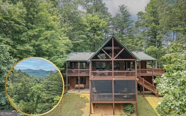 573 Hiawatha Trl, Blue Ridge, GA 30513 - back of house featuring a wooden deck, a forest view, stairs, and log veneer siding