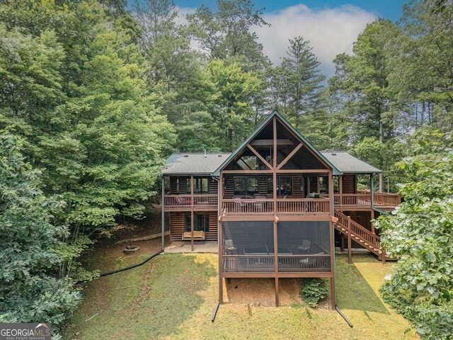 573 Hiawatha Trl, Blue Ridge, GA 30513 - back of house with a wooden deck, log veneer siding, a lawn, stairs, and a wooded view