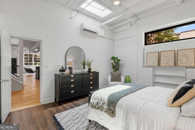 820 Dekalb Ave NE Unit 2, Atlanta, GA 30307 - bedroom with a wall unit AC and dark wood-type flooring