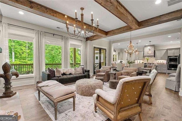131 Forsyth Park Ln, Woodstock, GA 30188 - living area featuring a chandelier, beam ceiling, wood finished floors, and recessed lighting