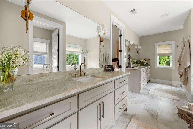 131 Forsyth Park Ln, Woodstock, GA 30188 - bathroom featuring vanity, baseboards, and marble finish floors