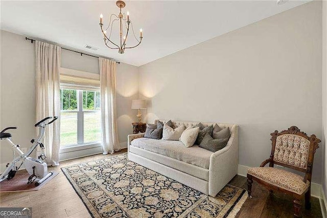131 Forsyth Park Ln, Woodstock, GA 30188 - living room with a chandelier, wood finished floors, and baseboards