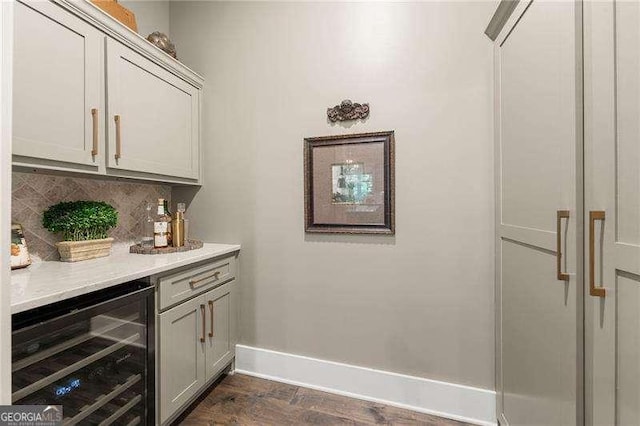 131 Forsyth Park Ln, Woodstock, GA 30188 - indoor dry bar featuring wine cooler, baseboards, tasteful backsplash, and dark wood finished floors