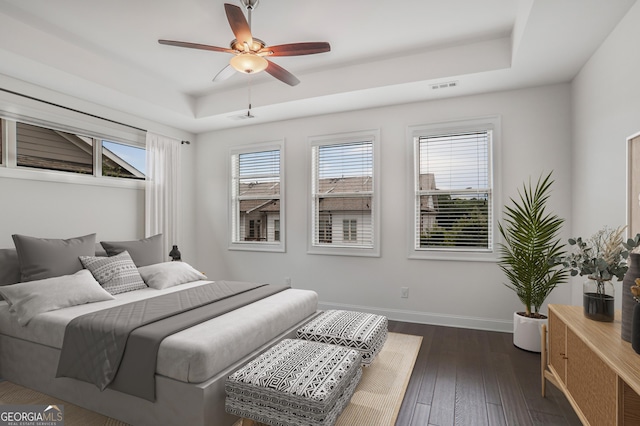4202 Deming Cir, Sandy Springs, GA 30342 - bedroom with a raised ceiling, dark wood-style floors, and a ceiling fan