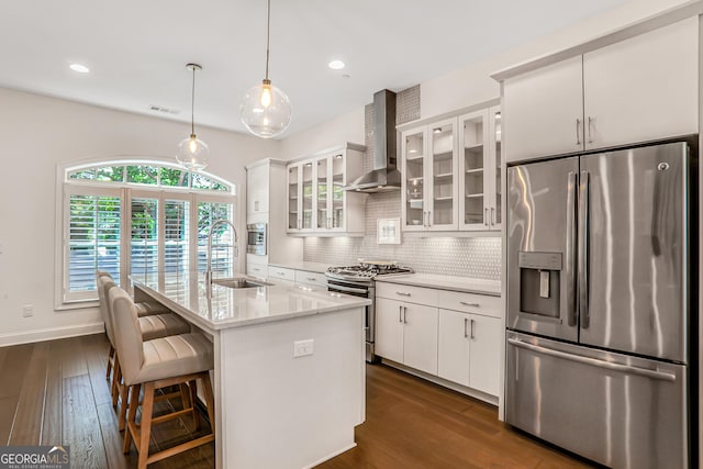 4202 Deming Cir, Sandy Springs, GA 30342 - kitchen with appliances with stainless steel finishes, wall chimney exhaust hood, dark wood-style flooring, white cabinets, and recessed lighting