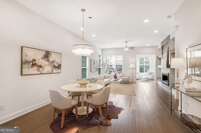 4202 Deming Cir, Sandy Springs, GA 30342 - dining room with dark wood-style flooring, a fireplace, a ceiling fan, and recessed lighting