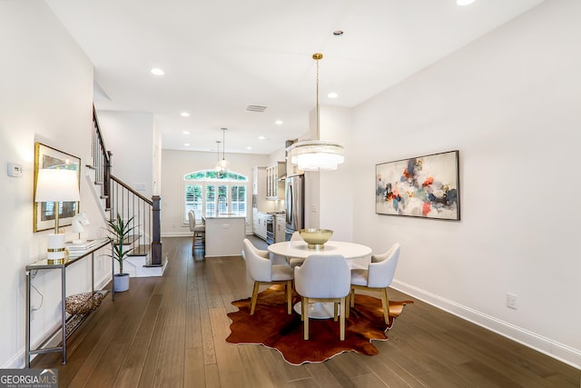 4202 Deming Cir, Sandy Springs, GA 30342 - dining area with dark wood finished floors, stairs, and recessed lighting