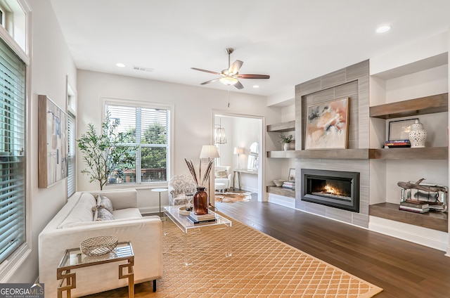 4202 Deming Cir, Sandy Springs, GA 30342 - living area featuring wood finished floors, ceiling fan, a fireplace, and recessed lighting