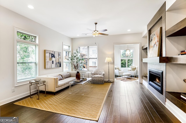 4202 Deming Cir, Sandy Springs, GA 30342 - living area featuring dark wood-type flooring, a ceiling fan, a fireplace, and recessed lighting