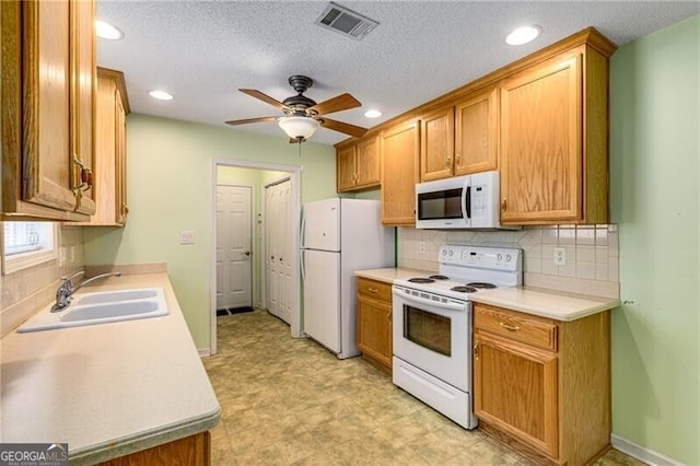 115 Pinnacle Ln, Mcdonough, GA 30253 - kitchen with white appliances, a ceiling fan, tasteful backsplash, recessed lighting, and light countertops