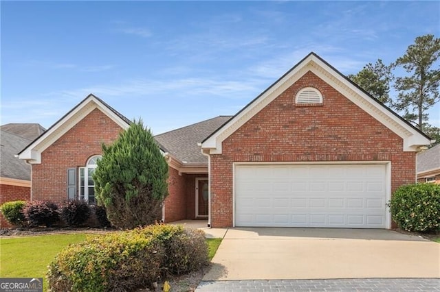 115 Pinnacle Ln, Mcdonough, GA 30253 - view of front of home with concrete driveway, brick siding, and a garage