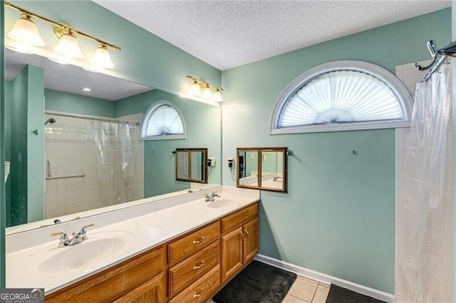 115 Pinnacle Ln, Mcdonough, GA 30253 - bathroom with tile patterned flooring, double vanity, curtained shower, and a textured ceiling