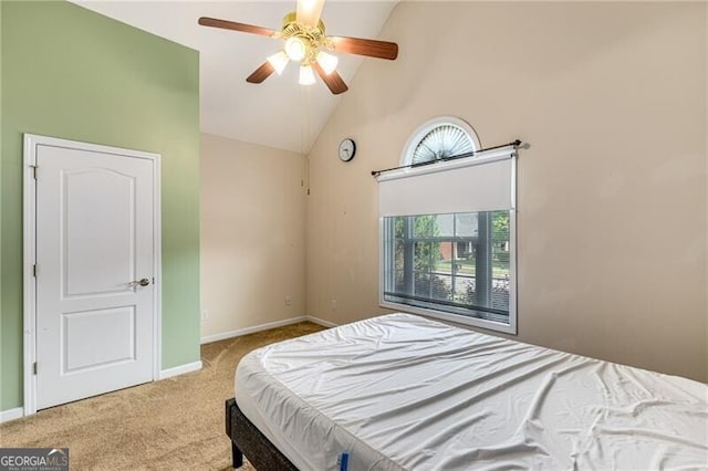 115 Pinnacle Ln, Mcdonough, GA 30253 - carpeted bedroom with high vaulted ceiling, baseboards, and ceiling fan