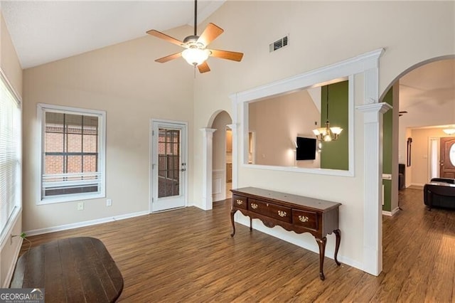115 Pinnacle Ln, Mcdonough, GA 30253 - living room featuring arched walkways, high vaulted ceiling, wood finished floors, ceiling fan, and ornate columns